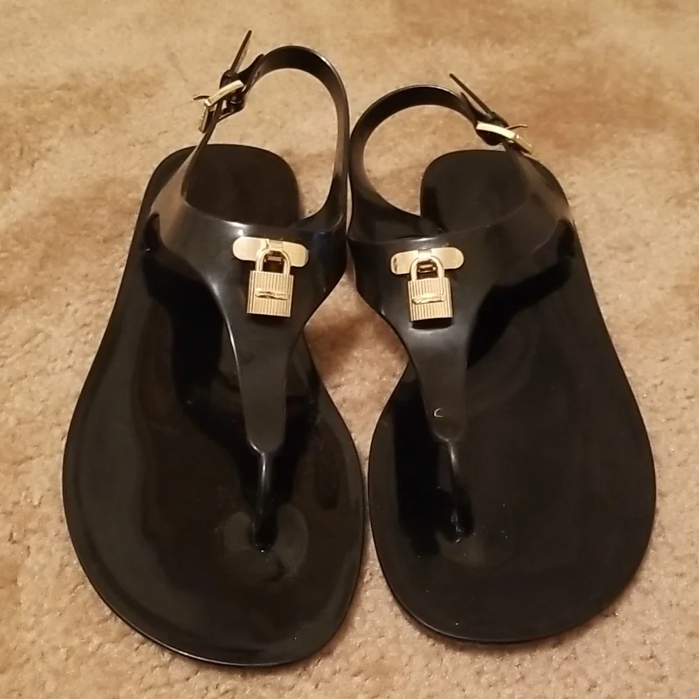 Michael Kors Black Jelly Thong Sandals with Gold Padlock Accent